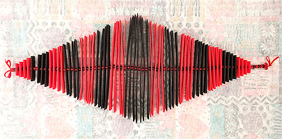 Plastic Canvas Strips threaded onto cord.